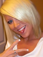 Monroe Lee takes off her white sweater in the mirror.